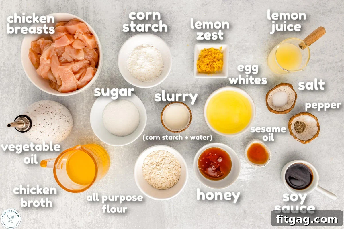Golden Glazed Lemon Chicken 4 Overhead shot of chinese lemon chicken ingredients measured out into small bowls ready to be used in the recipe. Ingredients have a text overlay.