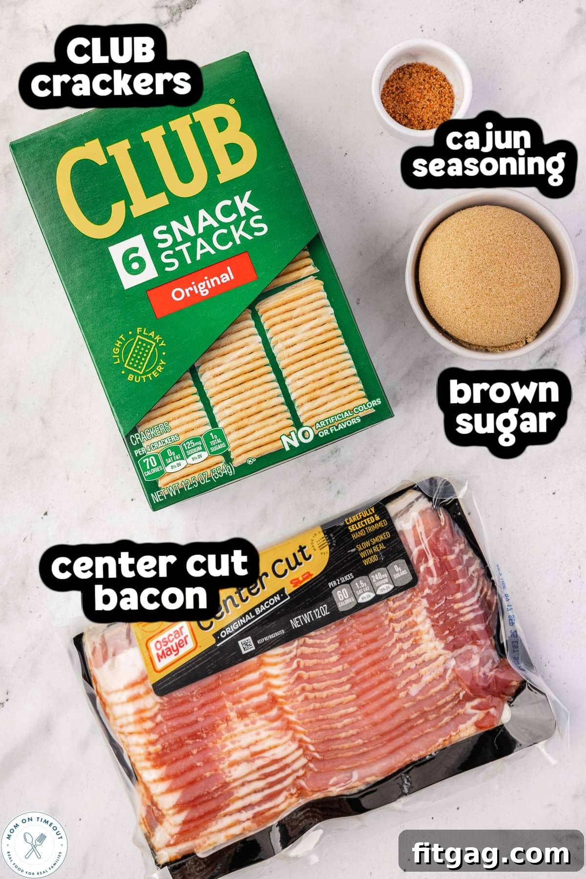 Overhead view of the four main ingredients for bacon crackers: club crackers, raw center-cut bacon, brown sugar, and a small bowl of Cajun seasoning, all arranged with a text label.