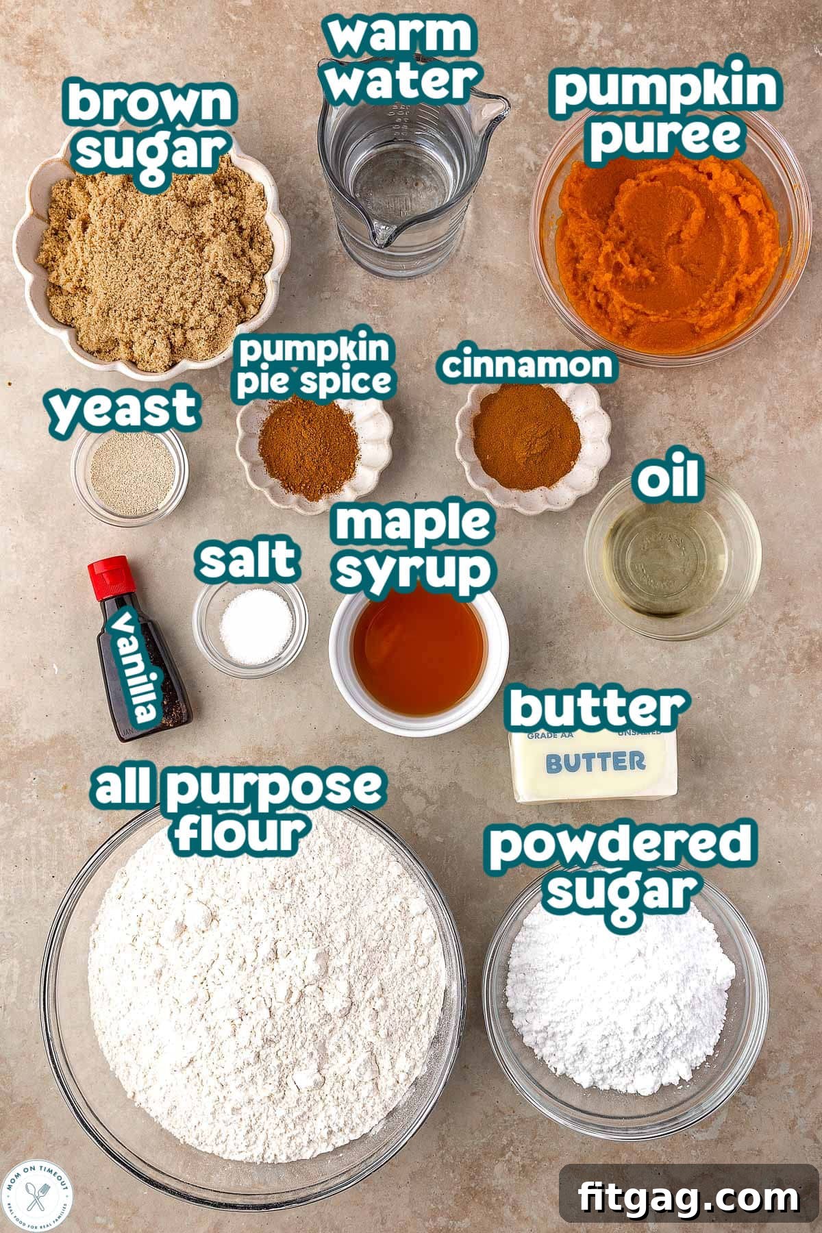 Overhead shot of pumpkin cinnamon roll focaccia ingredients measured out into small bowls and labeled.