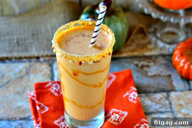 This Pumpkin Pie Milkshake is the perfect way to celebrate fall! It's like Pumpkin Pie in a glass - but better and so much EASIER! // Mom On Timeout #pumpkinpie #pumpkinpieshake #pumpkin #recipes #fall #Thanksgiving pumpkin pie milkshake with caramel drizzle