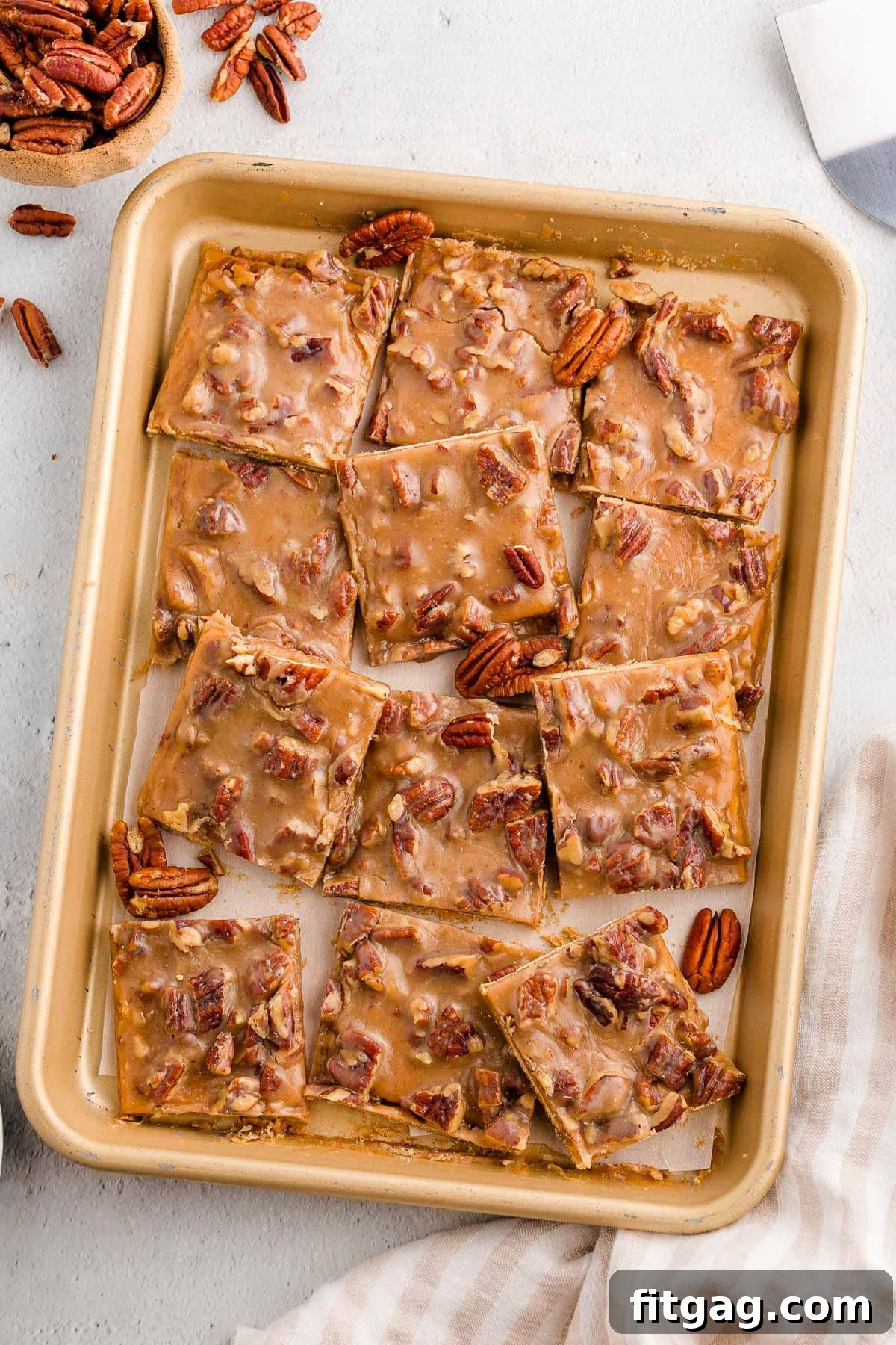 Toasted Pecan Brittle 6 Overhead shot of a quarter sheet pan filled with golden-brown pieces of freshly baked pecan pie bark.