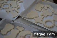 Baked salt dough ornaments drying on a parchment-lined baking sheet