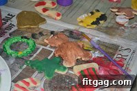 A collection of beautifully painted and glittered salt dough Christmas ornaments
