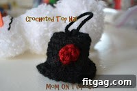 Closeup of a hand-crocheted miniature hat, ideal for a snowman ornament