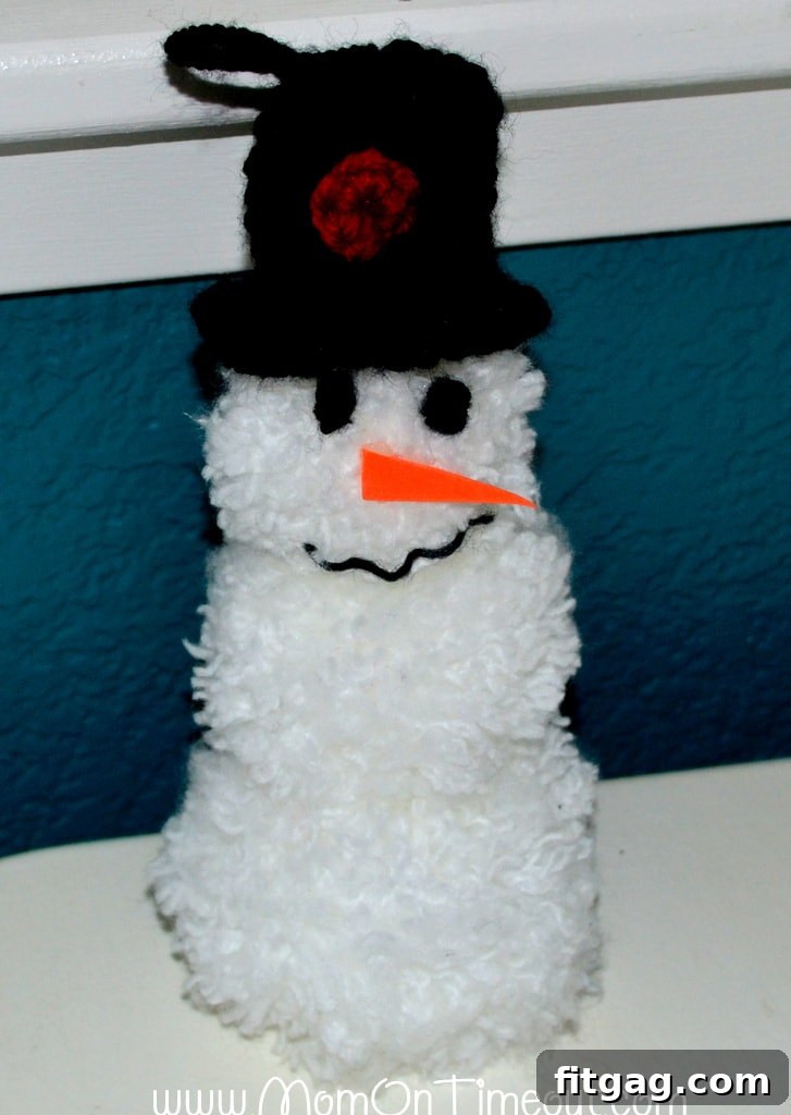 Finished Pom-Pom Snowman Ornament with hat and scarf