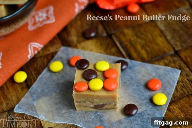 Close-up of Reese's Peanut Butter Fudge with whole peanut butter cups nestled inside before chilling.