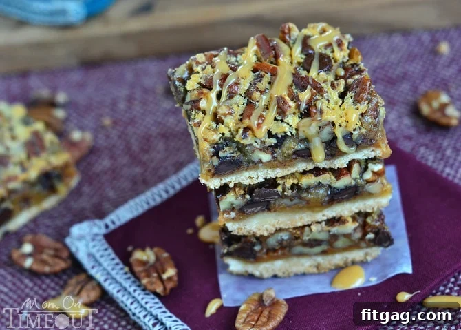 Perfectly baked Turtle Pecan Pie Bars, cut into neat squares, showcasing their distinct layers of golden crust, caramel, pecans, and melted chocolate chips.