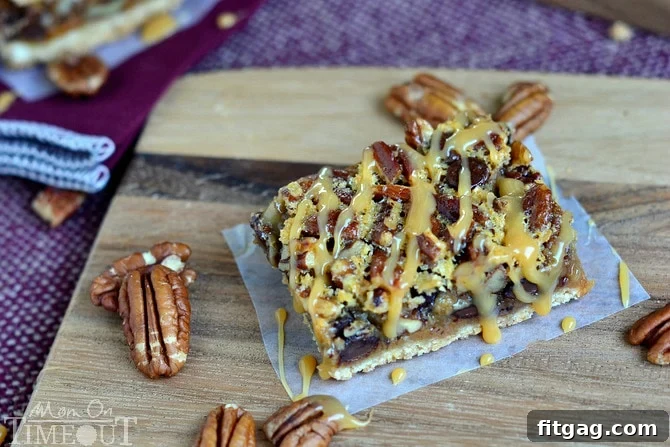 A tray of freshly baked Turtle Pecan Pie Bars, showcasing the generous pecan topping and caramel drizzle.