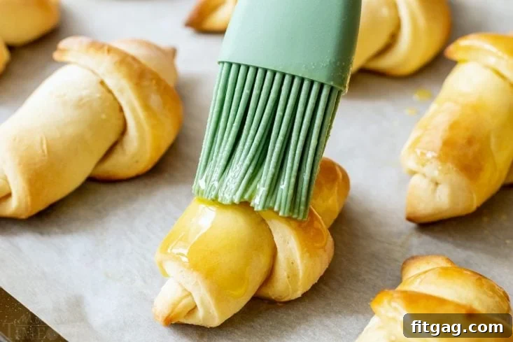 Homemade Crescent Rolls, brushed with melted butter for a perfect finish