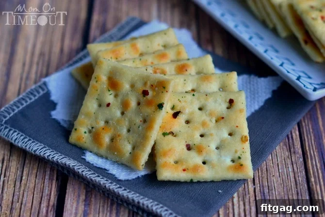 Simple & Addictive Spicy Ranch Crackers | MomOnTimeout.com Spicy ranch crackers arranged on a plate, ready for serving