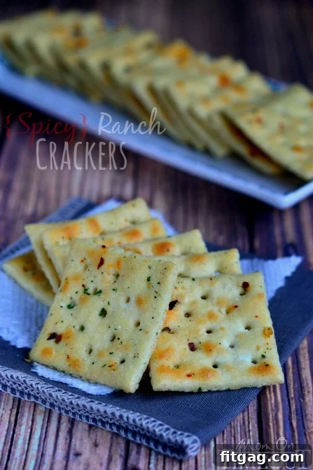 Making Spicy Ranch Crackers: An Easy Recipe | MomOnTimeout.com Close-up of golden brown spicy ranch crackers
