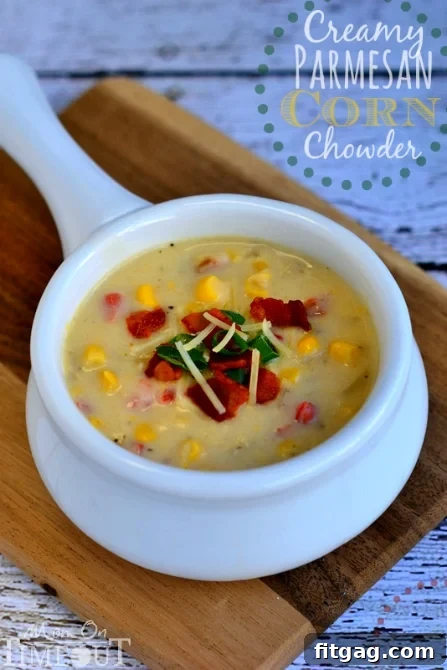 Delicious Creamy Parmesan Corn Chowder with fresh herbs, ready to be served.