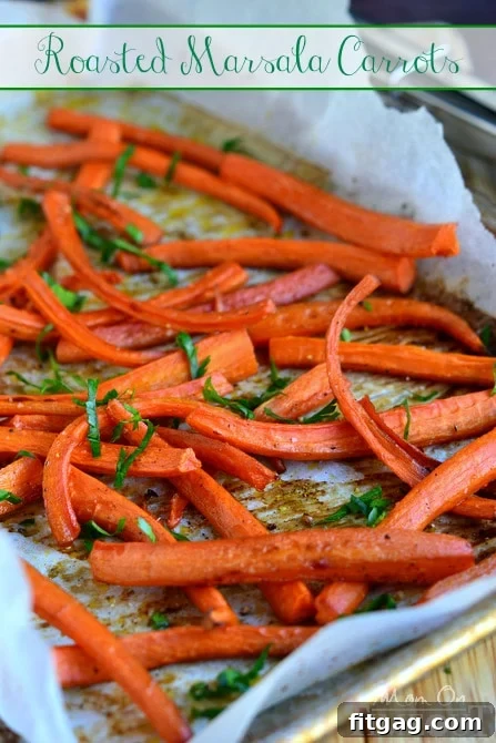Close-up of freshly roasted Marsala carrots garnished with fresh parsley on a white plate.