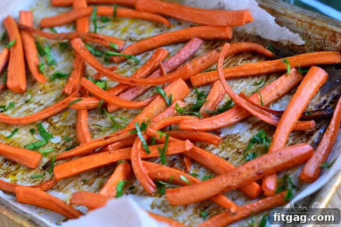 Overhead shot of Roasted Marsala Carrots tossed with fresh parsley, ready to be served.
