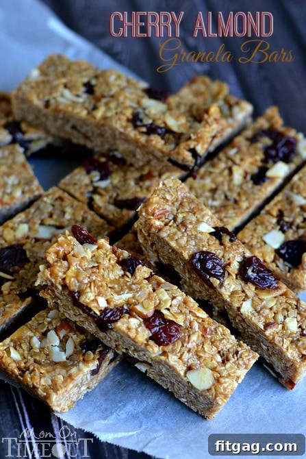 Homemade Granola Bars are SO much better than store bought! Chewy, 10 minutes to make and NO BAKE! You're going to love these Cherry Almond Granola Bars! Homemade granola bars featuring cherry and almond