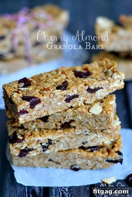 Homemade Granola Bars are SO much better than store bought! Chewy, 10 minutes to make and NO BAKE! You're going to love these Cherry Almond Granola Bars! Cherry Almond Granola Bars, freshly cut