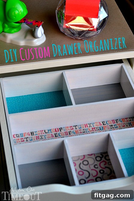 A vibrant, custom DIY drawer organizer made from wood and decorated with an array of colorful Scotch Washi Tapes, ready for use within a desk drawer.
