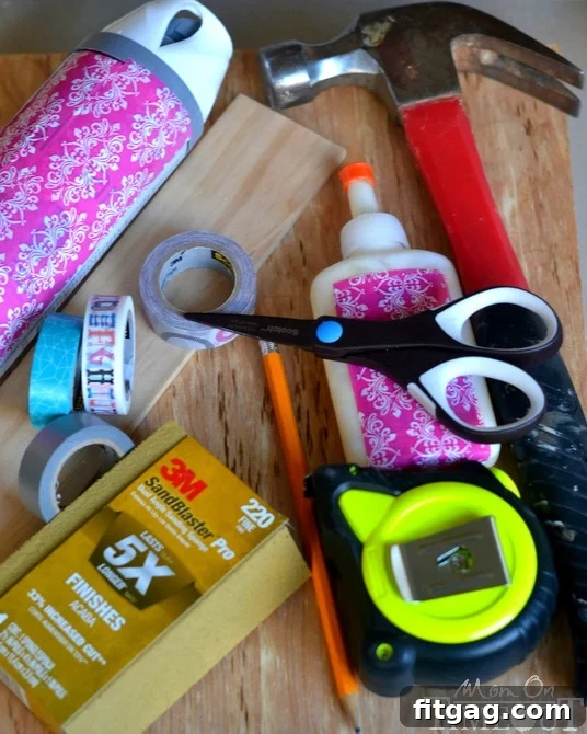 A flat lay of craft supplies specifically chosen for a DIY drawer organizer project, including various Scotch Washi Tapes, precision scissors, wood lattice, sandpaper, and paint.