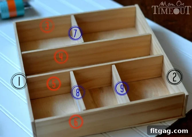 An organized layout of cut lattice wood pieces arranged on a plywood base, demonstrating the planned compartment design for the DIY drawer organizer before assembly.