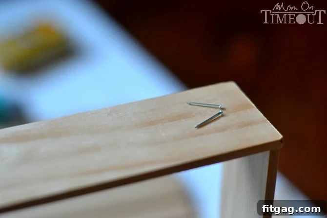 Assembled wooden dividers for a custom drawer organizer, showing the nailed joints and overall framework ready for the next steps.