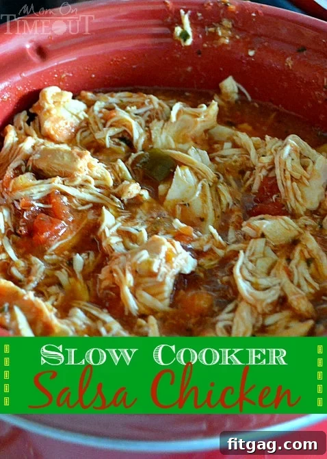 Slow Cooker Salsa Chicken is perfect for nachos, burritos, tacos, quesadillas and more! A close-up shot of shredded salsa chicken in a slow cooker.