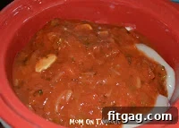 Shredded Slow Cooker Salsa Chicken in the slow cooker, ready to be served.