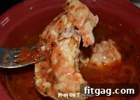 A close-up of tender, shredded salsa chicken, perfectly cooked and ready to incorporate into your favorite Mexican dishes.