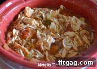Shredded Salsa Chicken served in a bowl, garnished with fresh cilantro.