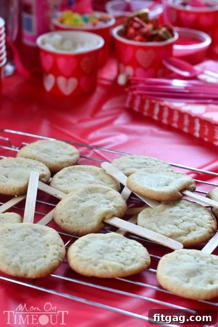 Kids' beautifully decorated Valentine Cookie Pops during a festive party.
