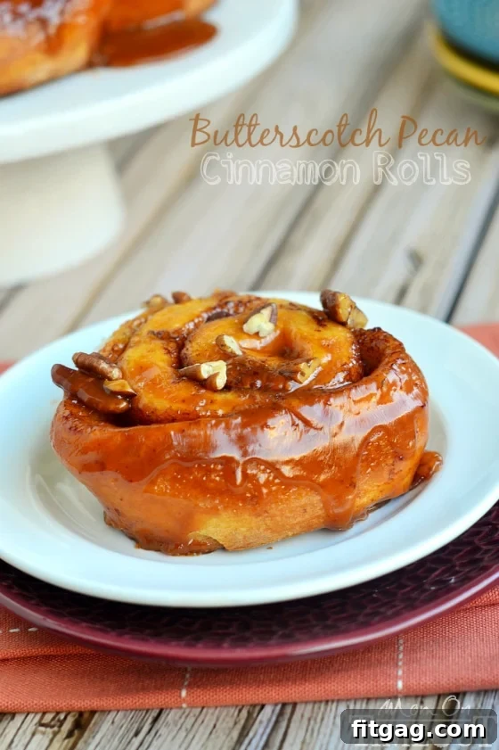 Easy Butterscotch Pecan Cinnamon Rolls - A Quick Breakfast Indulgence Close-up of freshly baked Easy Butterscotch Pecan Cinnamon Rolls, glistening with a rich butterscotch glaze and chopped pecans.