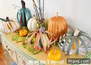 Inspiring Scrappy Pumpkin Craft Variations An array of Scrappy Pumpkins showcasing different sizes, paper patterns, and color combinations.