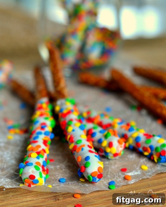Fun and easy, these Rainbow Pretzel Wands take just minutes to make and are perfectly scrumptious! | MomOnTimeout.com