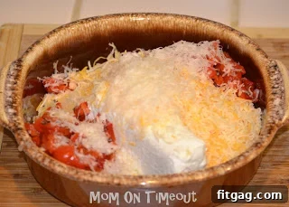 All ingredients for the dip are measured and ready in a baking dish before mixing.