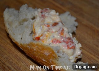 A spoonful of the creamy, cheesy Roasted Red Bell Pepper Dip, ready to be enjoyed.