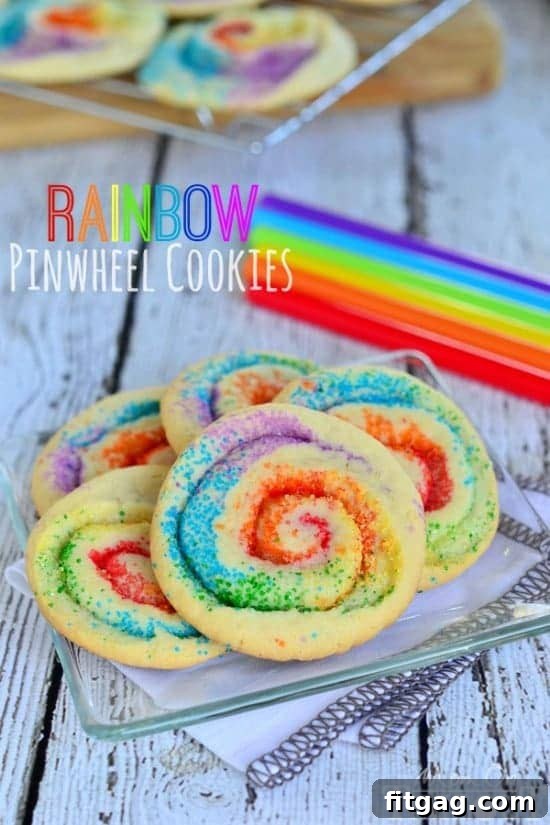 Vibrant Rainbow Pinwheel Cookies arranged on a cooling rack, showcasing their beautiful swirled colors.