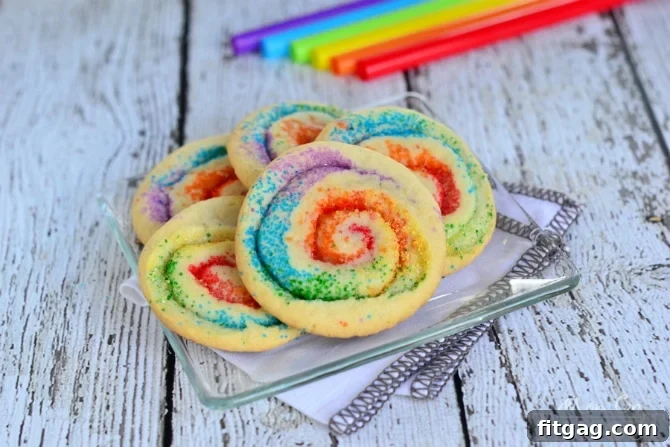Close-up of baked Rainbow Pinwheel Cookies, showing detailed color swirls and sparkling sugar texture.