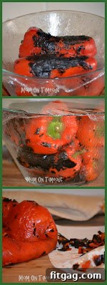Charred red bell peppers in a glass bowl covered with plastic wrap