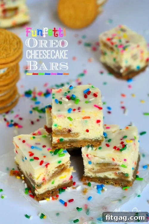 Stacked Funfetti Oreo Cheesecake Bars ready for serving. A stack of Funfetti Oreo Cheesecake Bars, drizzled with white chocolate and extra sprinkles.