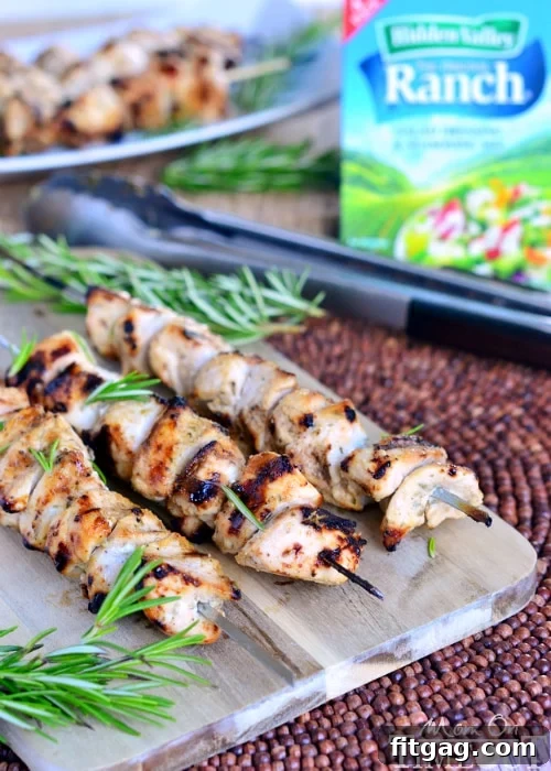 Rosemary Buttermilk Ranch Chicken Skewers cooking on a hot grill, flames visible