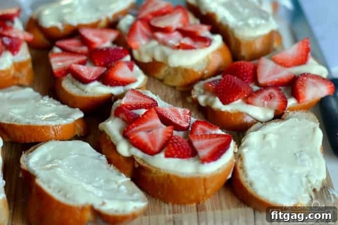 Overnight Strawberry Cheesecake French Toast Casserole from MomOnTimeout.com Assembled Overnight Strawberry Cheesecake French Toast Casserole in a baking dish, ready for refrigeration.