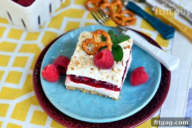 Raspberry Pretzel Dessert Salad | MomOnTimeout.com Close-up of the creamy layer of Raspberry Pretzel Dessert Salad, showing its smooth texture.