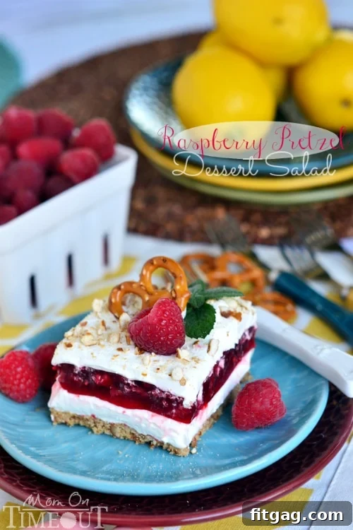 Raspberry Pretzel Dessert Salad | MomOnTimeout.com Top view of Raspberry Pretzel Dessert Salad, highlighting the bright raspberry layer.