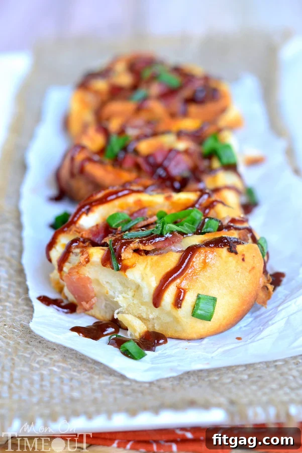 A plate of freshly baked Cheesy BBQ Chicken Bacon Pinwheels ready to be served