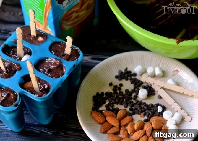 Freshly made Rocky Road Pudding Pops cooling on a wire rack after being carefully removed from their molds.