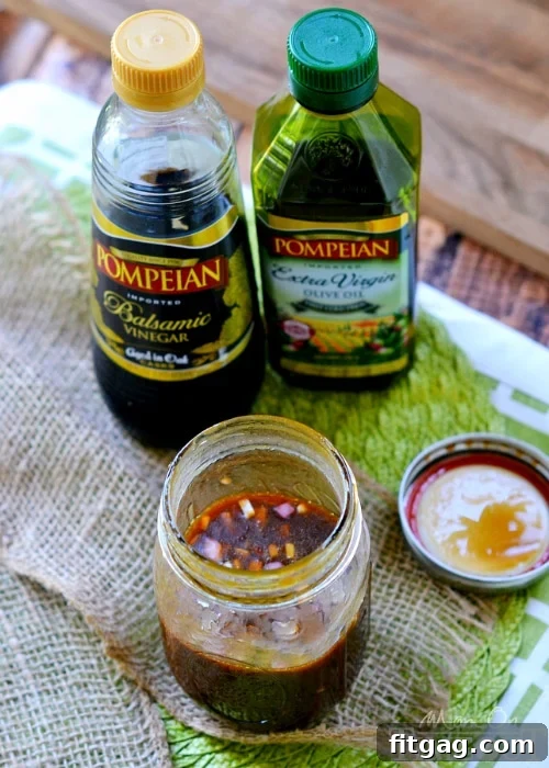 Glass jar of homemade Honey Balsamic Vinaigrette dressing