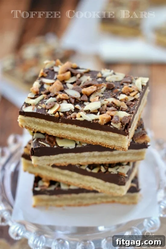 Buttery Toffee Blondies 5 A close-up of Toffee Cookie Bars arranged on a platter, ready to be served, emphasizing the inviting golden crust and rich topping.