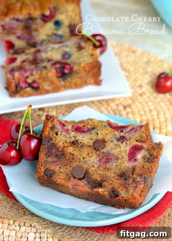 A serving of Chocolate Cherry Banana Bread, ready to be enjoyed, showcasing its rich texture and colorful inclusions.