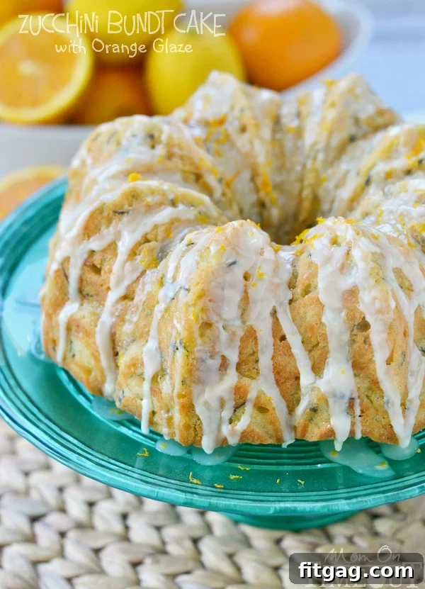 This perfectly moist Zucchini Bundt Cake with Orange Glaze will make a beautiful addition to any meal! | MomOnTimeout.com