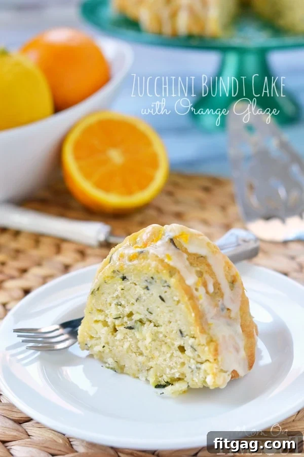 Garden-Fresh Zucchini Bundt 4 A stunning Zucchini Bundt Cake with Orange Glaze, perfectly inverted onto a wire rack, showcasing its intricate bundt shape.