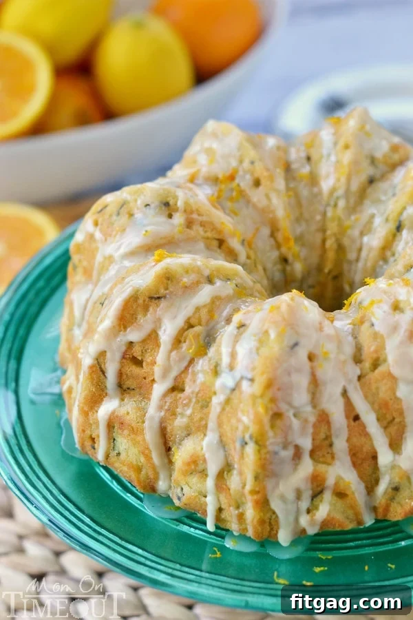 Garden-Fresh Zucchini Bundt 5 A close-up of the Zucchini Bundt Cake with Orange Glaze, showing the beautifully drizzled icing and the light, airy texture of the cake.